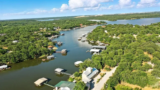 an aerial view of a houses with ocean view