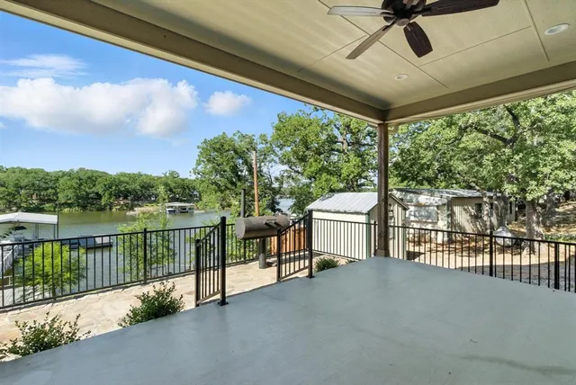 a view of a balcony with furniture