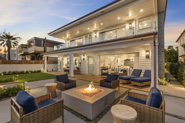 a outdoor space with patio the couches and a potted plant on a table with garden view
