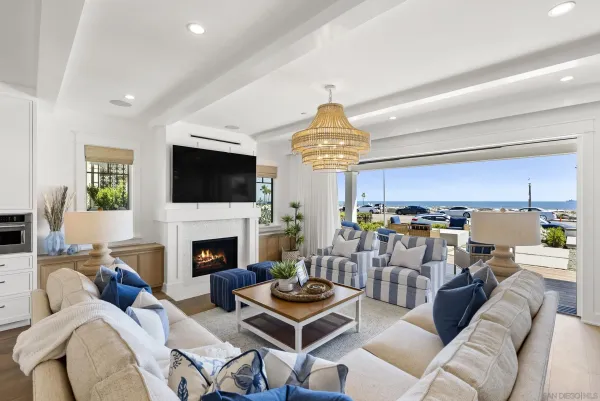 a living room with furniture fireplace and a window