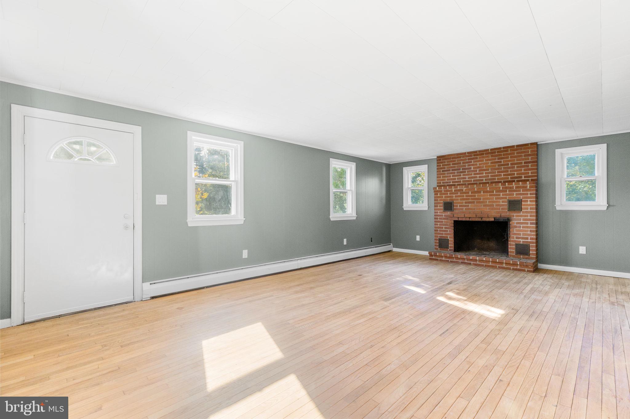 222 Rosehill Road West Grove, PA 19390 - Photo 5 of 23 Living room w/brick fireplace