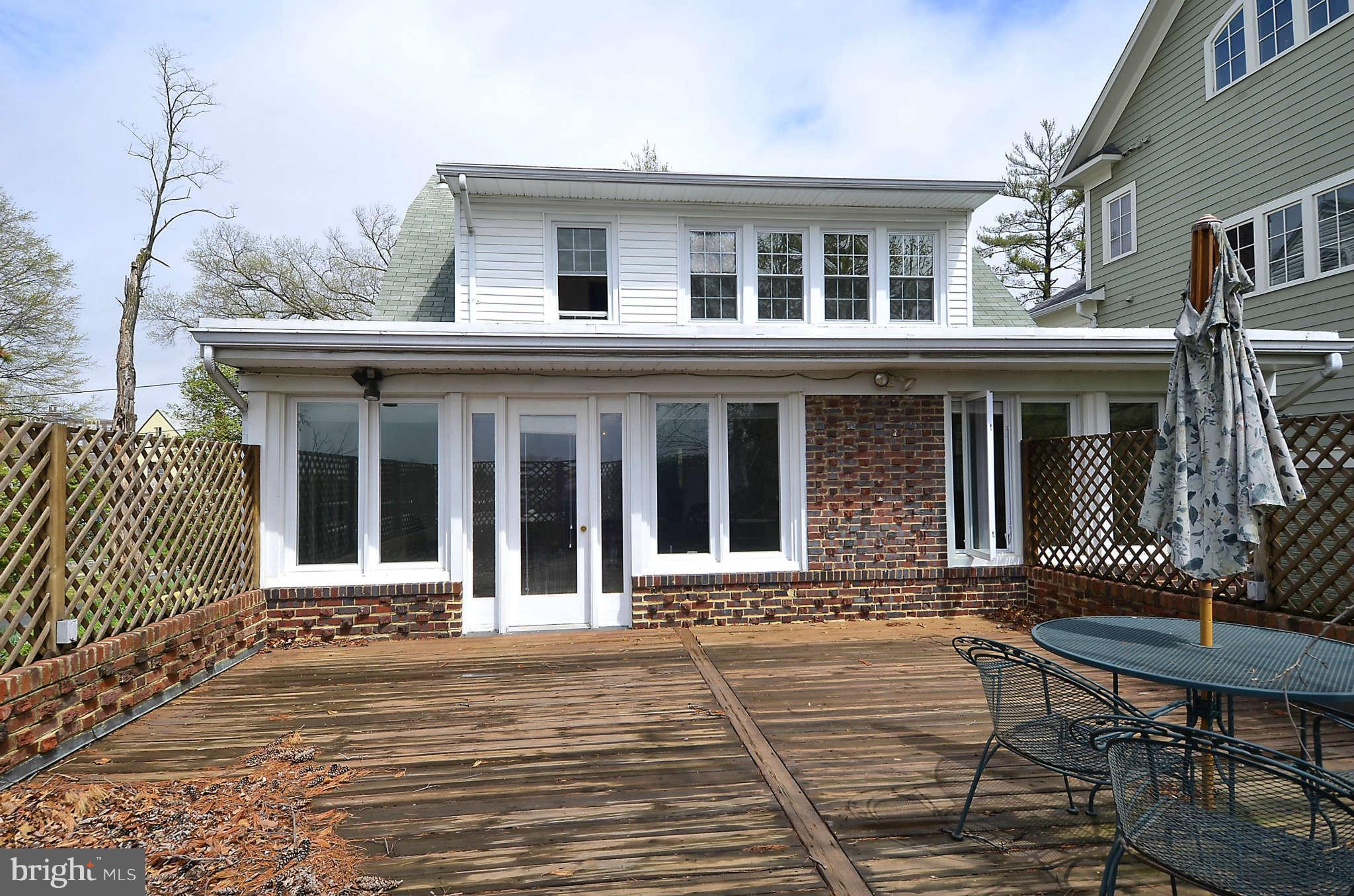 3814 Fulton Street Northwest Washington, DC 20007 - Photo 13 of 18 front view of a house with a bench
