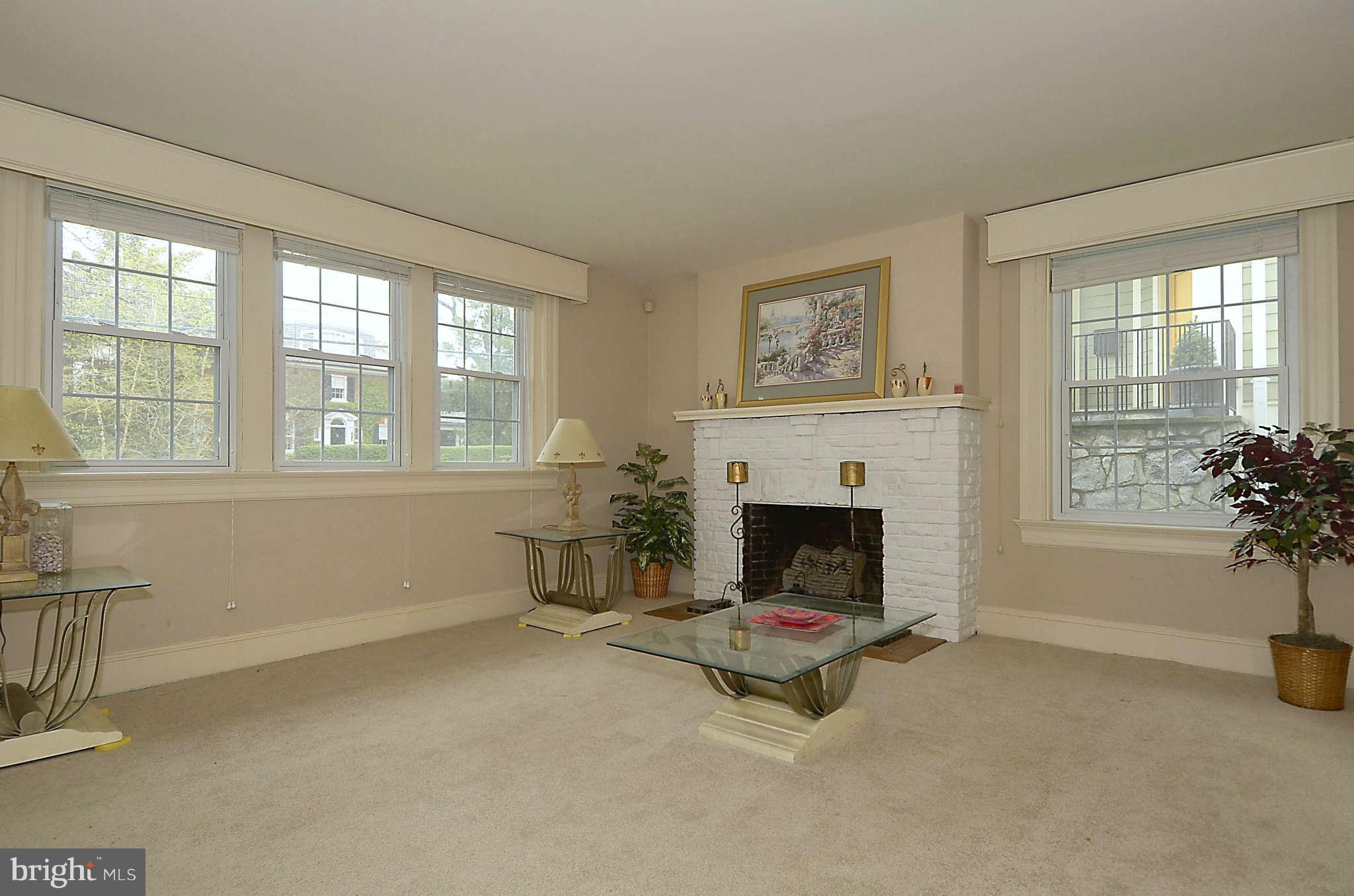 3814 Fulton Street Northwest Washington, DC 20007 - Photo 4 of 18 a living room with furniture and a fireplace