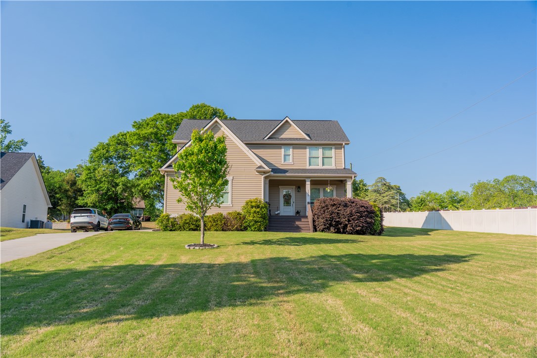 1000 Carlisle Place Anderson, SC 29621 - Photo 33 of 36 This classic suburban residence features a well-maintained lawn and inviting porch.