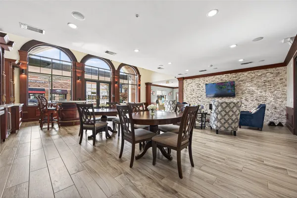 a view of a dining room with furniture window and wooden floor