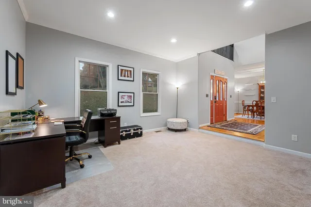a view of a livingroom with workspace and a couch