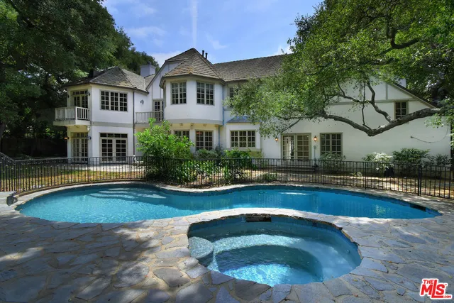 a view of a house with swimming pool