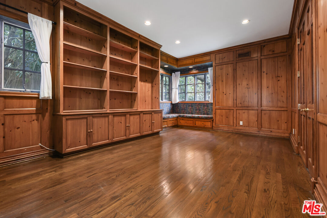 3254 Oakdell Road Studio City, CA 91604 - Photo 15 of 49 a view of an empty room with wooden floor and a window