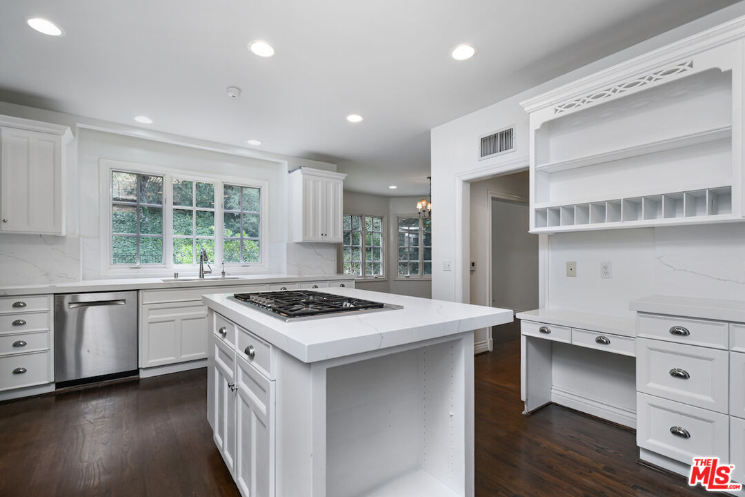 3254 Oakdell Road Studio City, CA 91604 - Photo 23 of 49 a kitchen with a stove a sink and wooden floor
