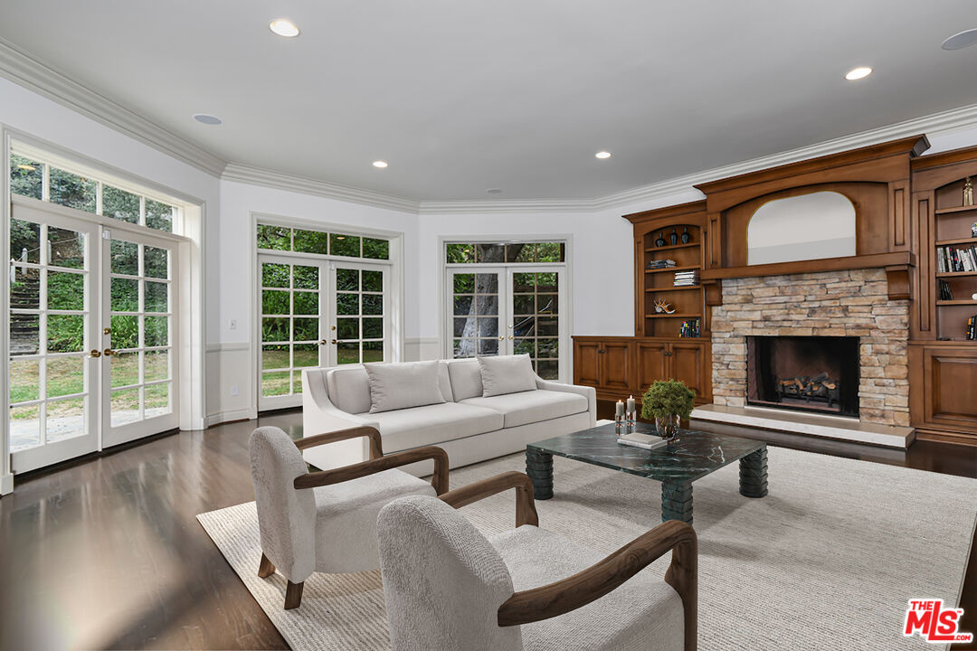 3254 Oakdell Road Studio City, CA 91604 - Photo 27 of 49 a living room with furniture and a fireplace