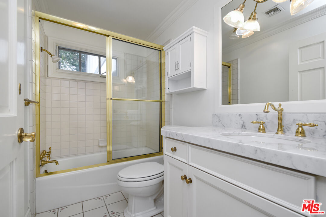 3254 Oakdell Road Studio City, CA 91604 - Photo 32 of 49 a bathroom with a granite countertop sink a toilet and shower