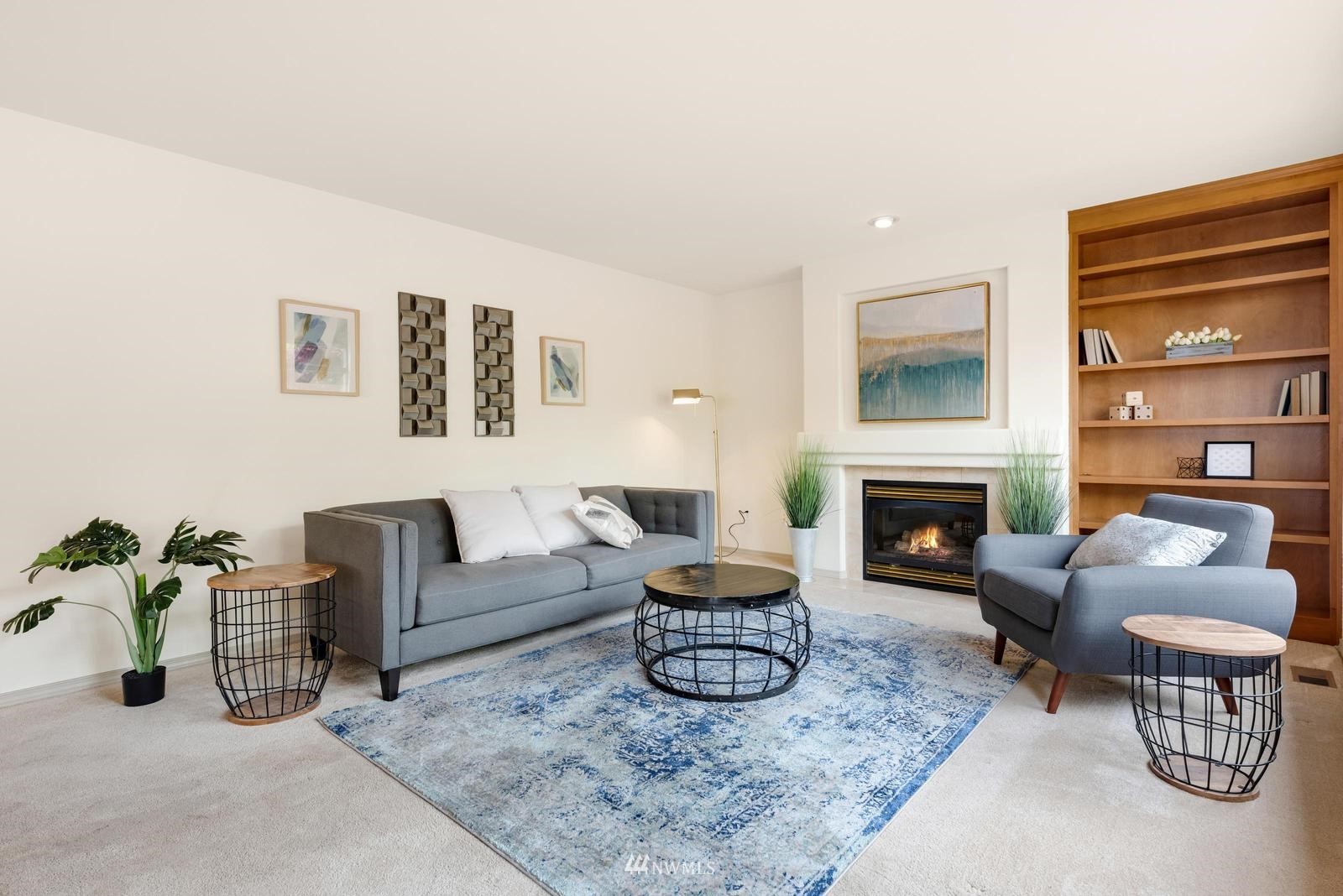 16218 Southeast 249th Place Covington, WA 98042 - Photo 11 of 38 a living room with furniture and a fireplace