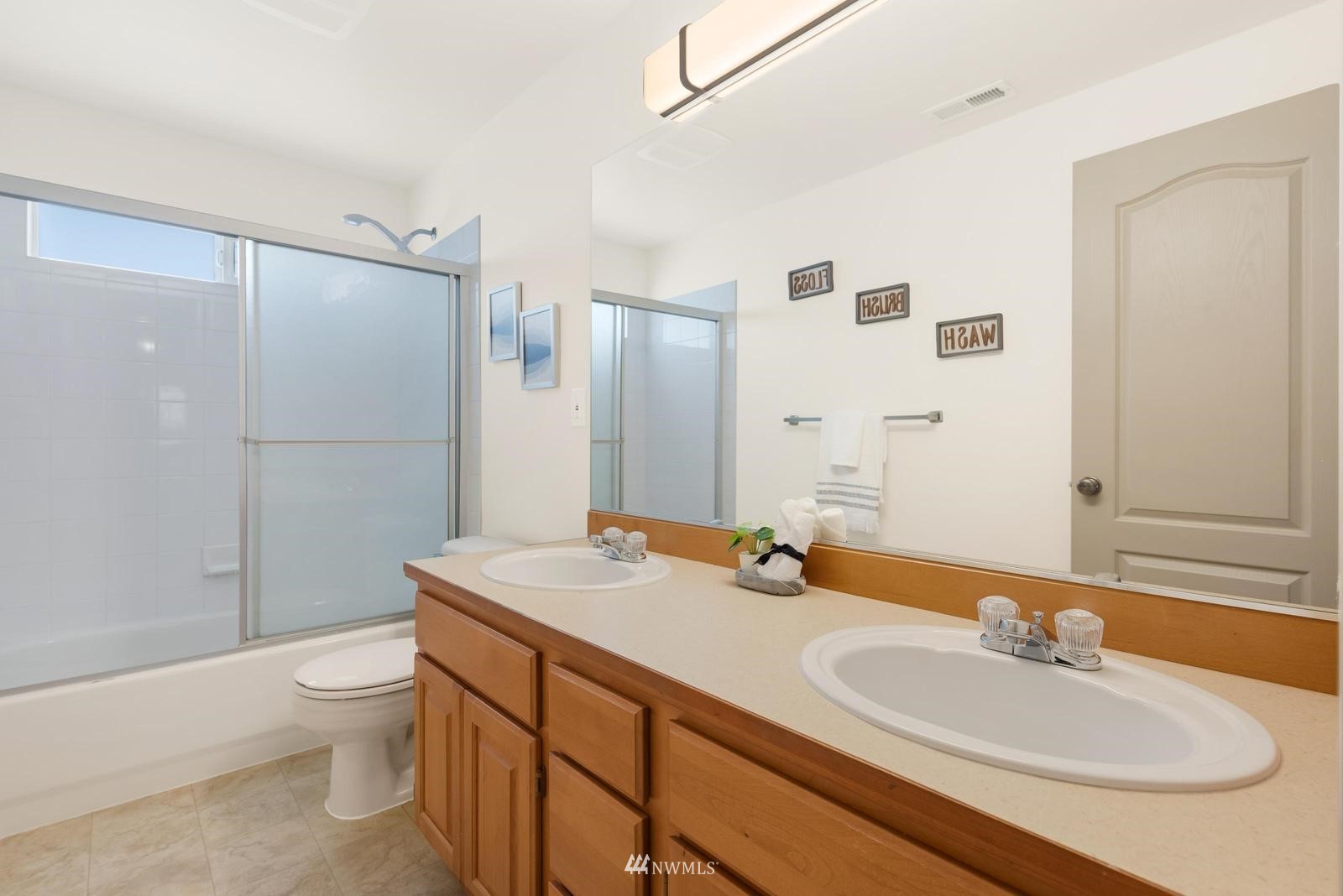 16218 Southeast 249th Place Covington, WA 98042 - Photo 17 of 38 a bathroom with a sink a toilet and shower