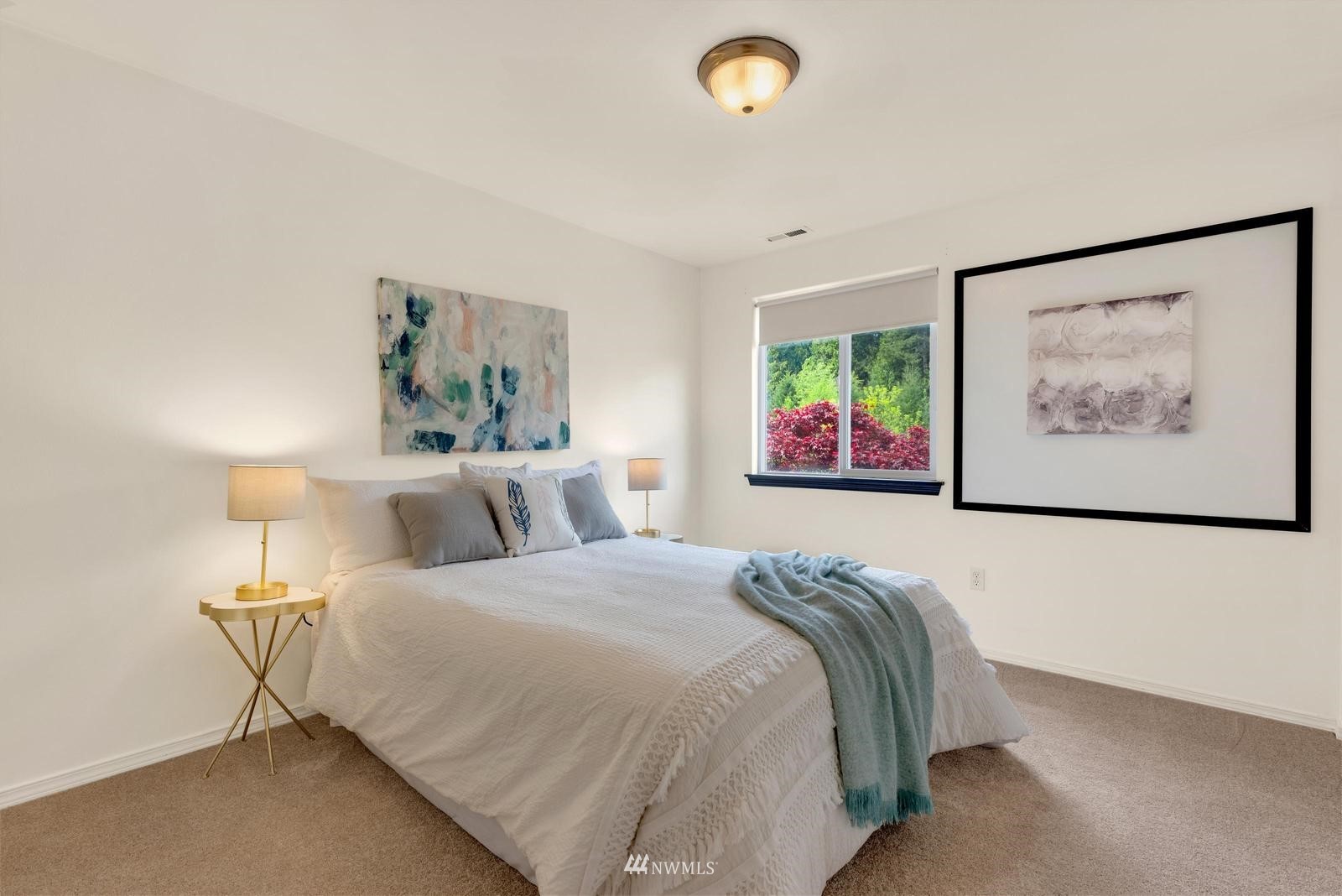 16218 Southeast 249th Place Covington, WA 98042 - Photo 19 of 38 a bedroom with a bed and painting on the wall