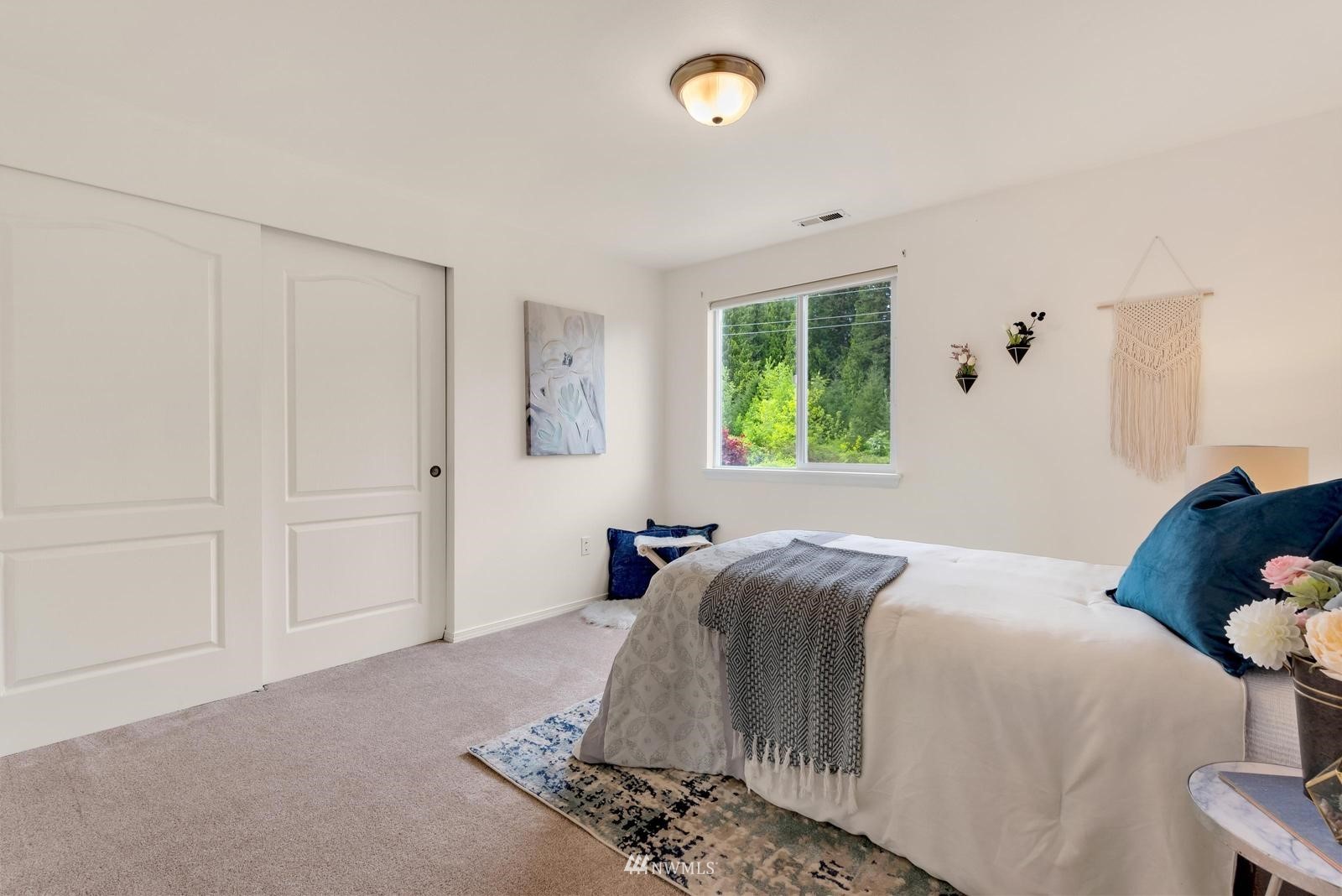 16218 Southeast 249th Place Covington, WA 98042 - Photo 20 of 38 a bedroom with a bed and wooden floor