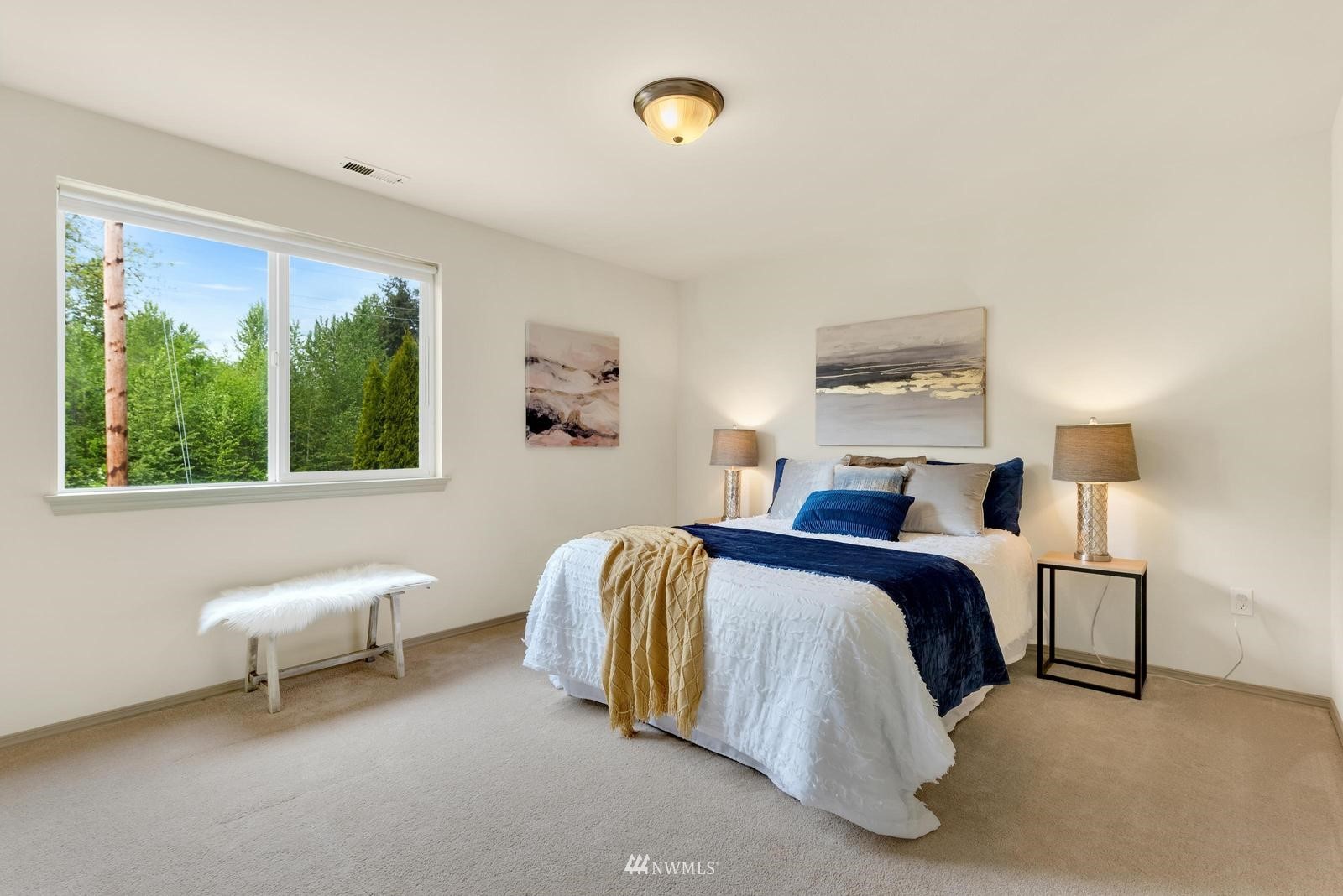 16218 Southeast 249th Place Covington, WA 98042 - Photo 21 of 38 a spacious bedroom with a bed and a window