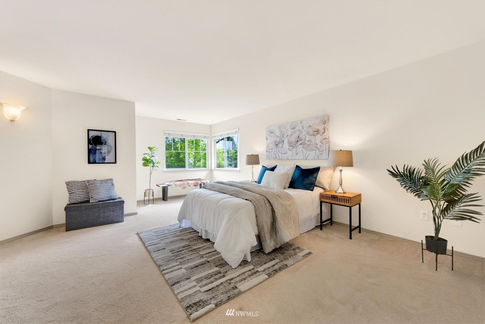 16218 Southeast 249th Place Covington, WA 98042 - Photo 25 of 38 a spacious bedroom with a bed and a potted plant