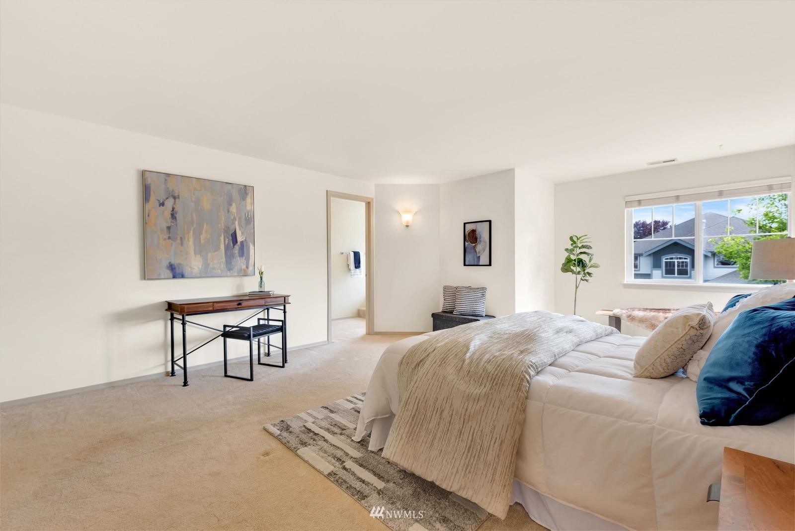 16218 Southeast 249th Place Covington, WA 98042 - Photo 26 of 38 a bedroom with a bed lamps and window