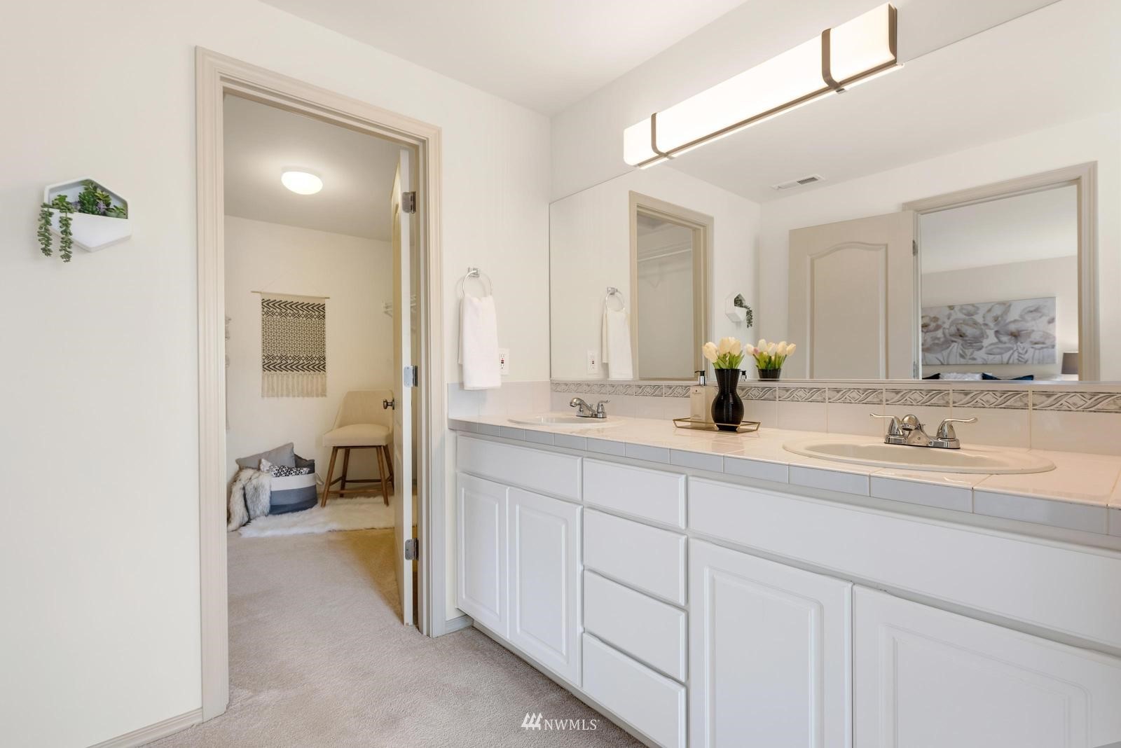 16218 Southeast 249th Place Covington, WA 98042 - Photo 28 of 38 a bathroom with a sink and a mirror