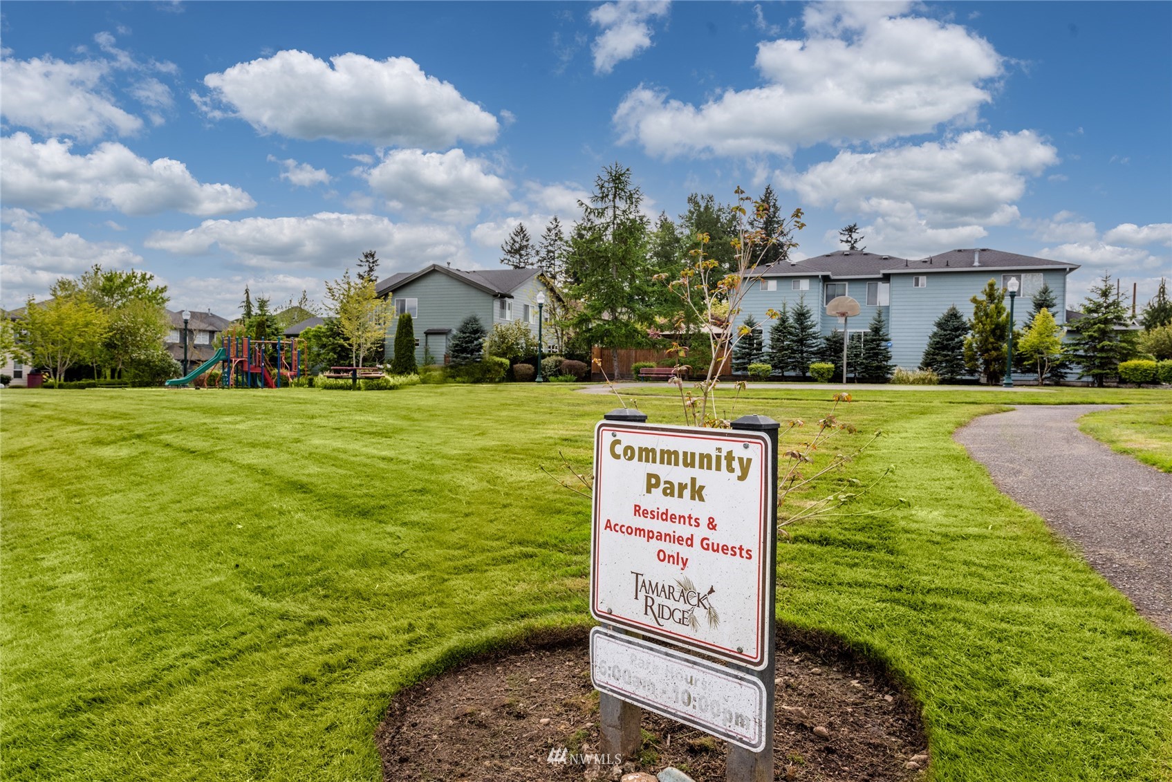 16218 Southeast 249th Place Covington, WA 98042 - Photo 37 of 38 a sign board with a play ground in the back