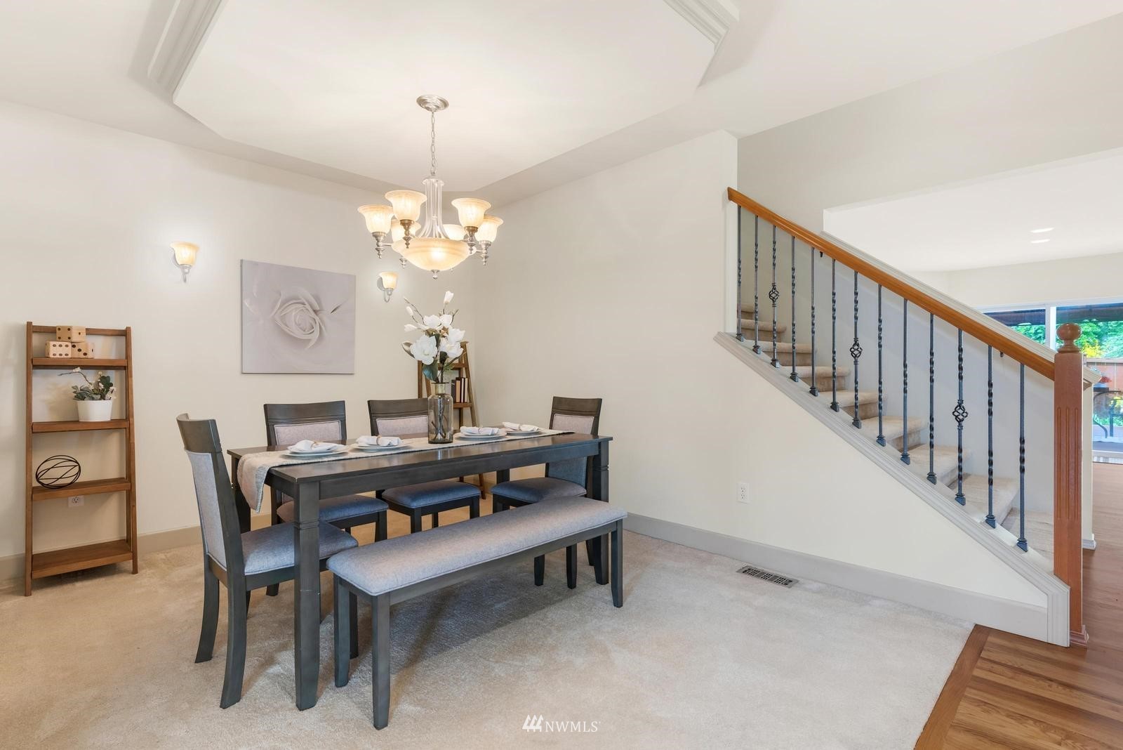 16218 Southeast 249th Place Covington, WA 98042 - Photo 6 of 38 a view of a dining room with furniture and a chandelier