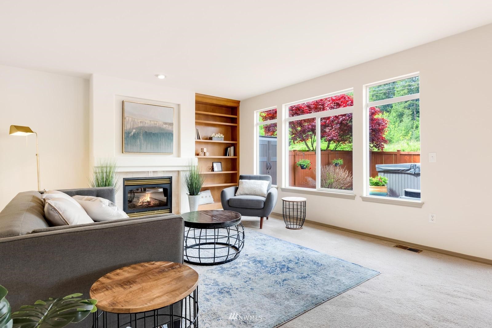 16218 Southeast 249th Place Covington, WA 98042 - Photo 9 of 38 a living room with furniture and a fireplace