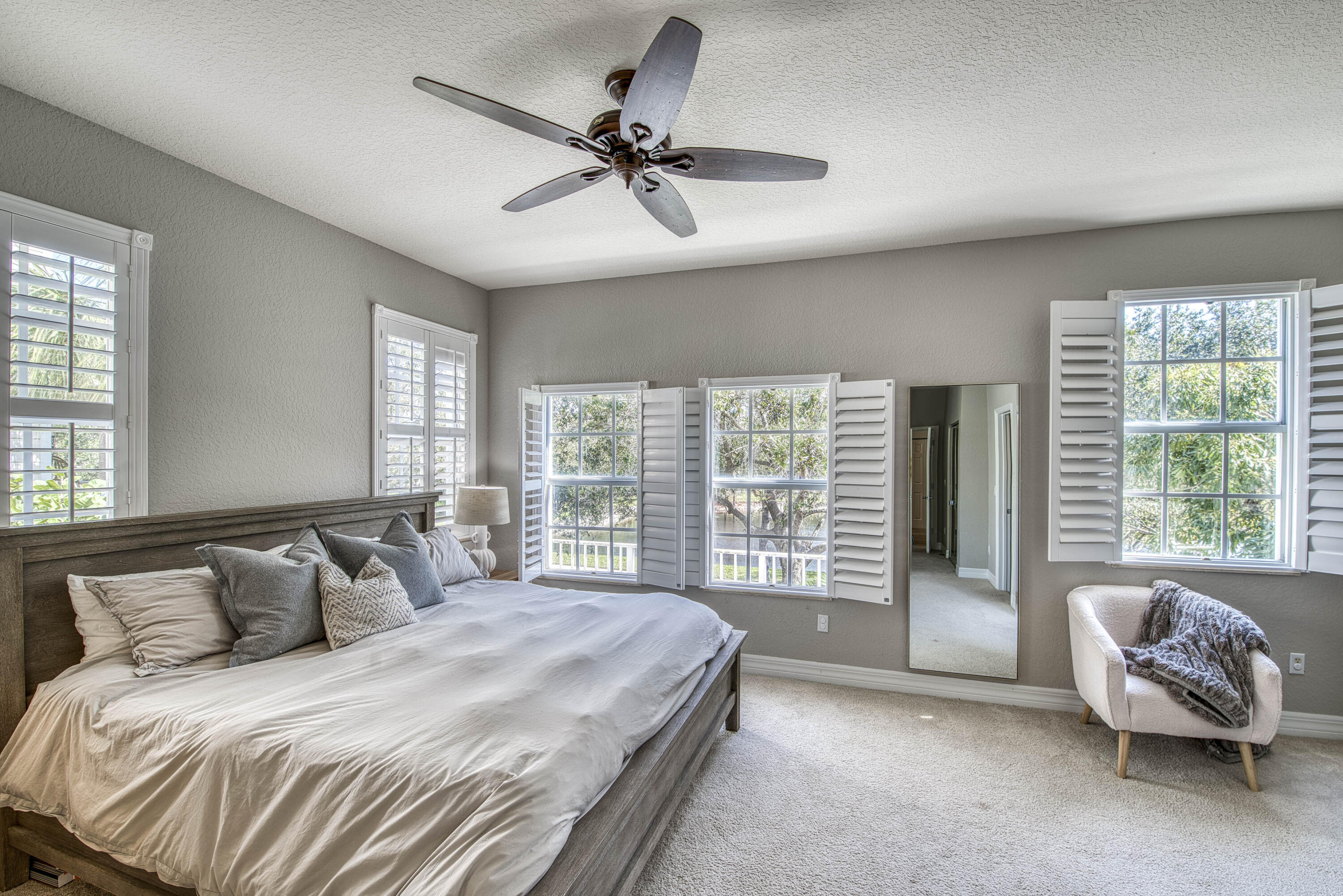 120 West Thatch Palm Circle Jupiter, FL 33458 - Photo 21 of 41 a bedroom with a bed and a couch