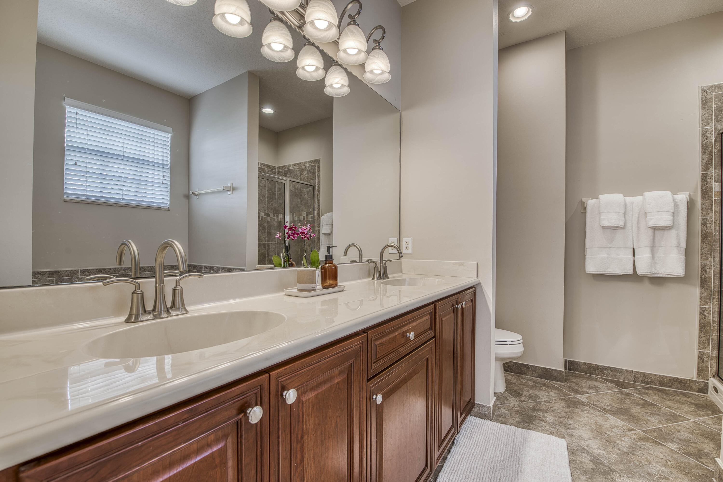 120 West Thatch Palm Circle Jupiter, FL 33458 - Photo 23 of 41 a bathroom with a sink a light fixture and a mirror