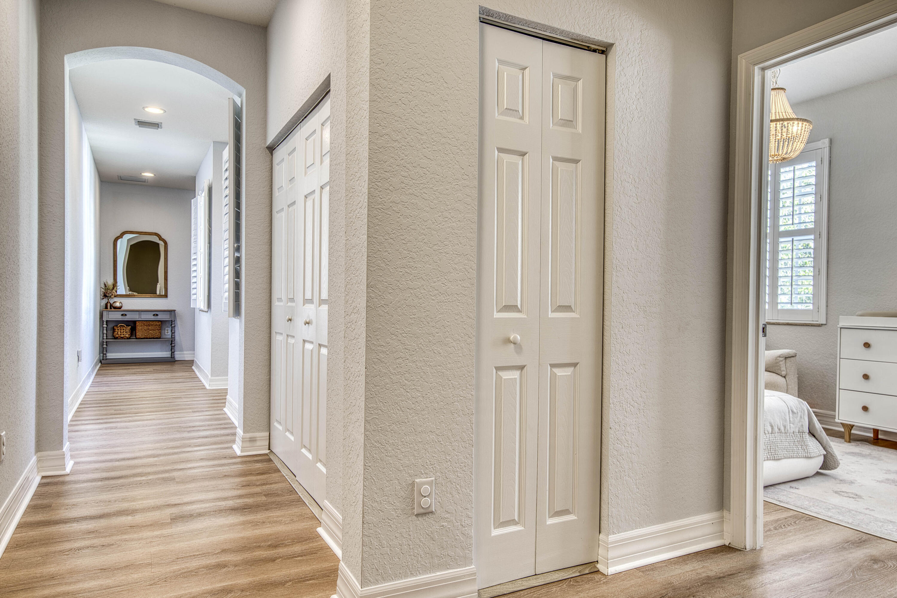 120 West Thatch Palm Circle Jupiter, FL 33458 - Photo 24 of 41 a view of a hallway with wooden floor and closet area