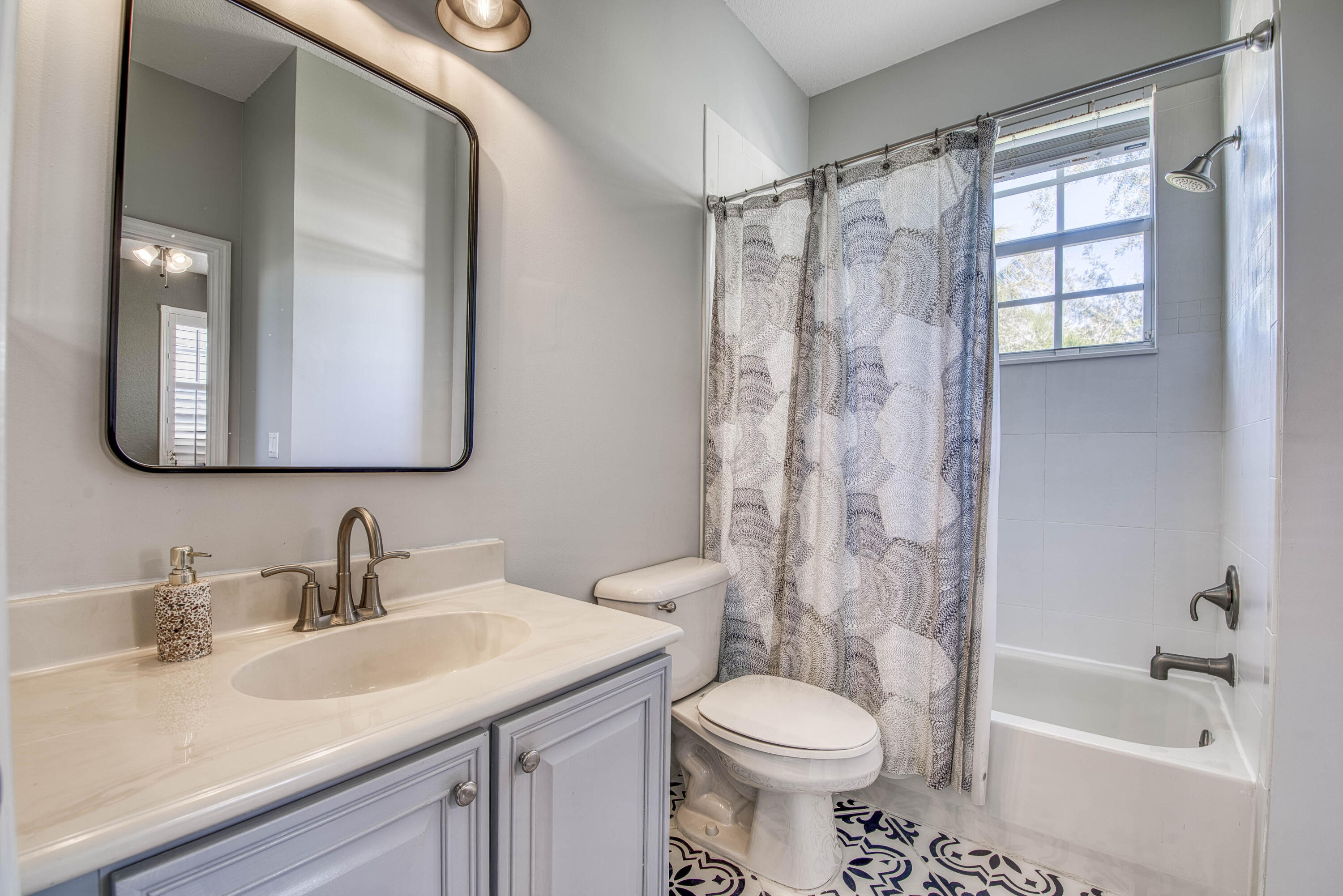 120 West Thatch Palm Circle Jupiter, FL 33458 - Photo 26 of 41 a bathroom with a sink toilet and shower