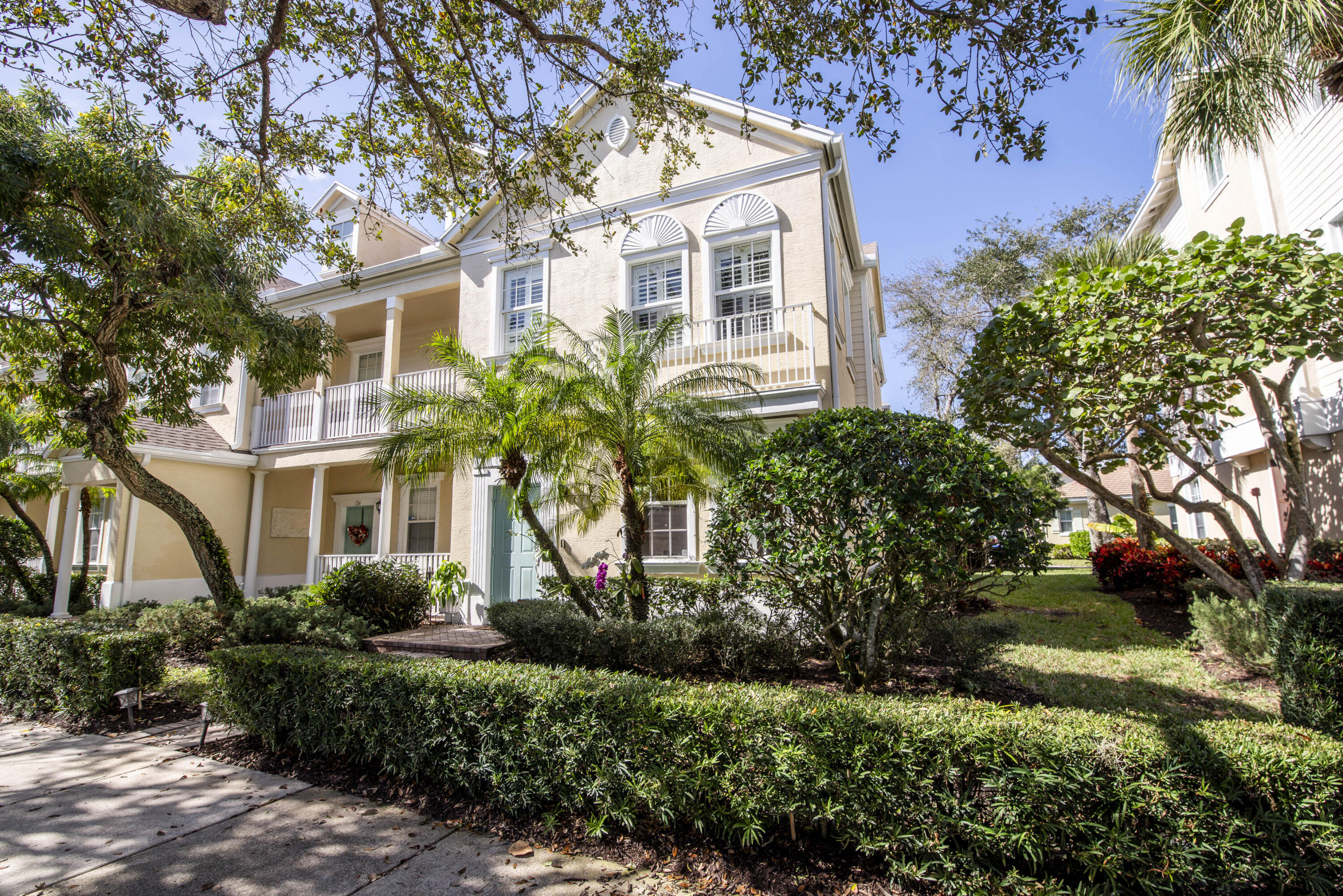 120 West Thatch Palm Circle Jupiter, FL 33458 - Photo 32 of 41 a front view of a house with a garden