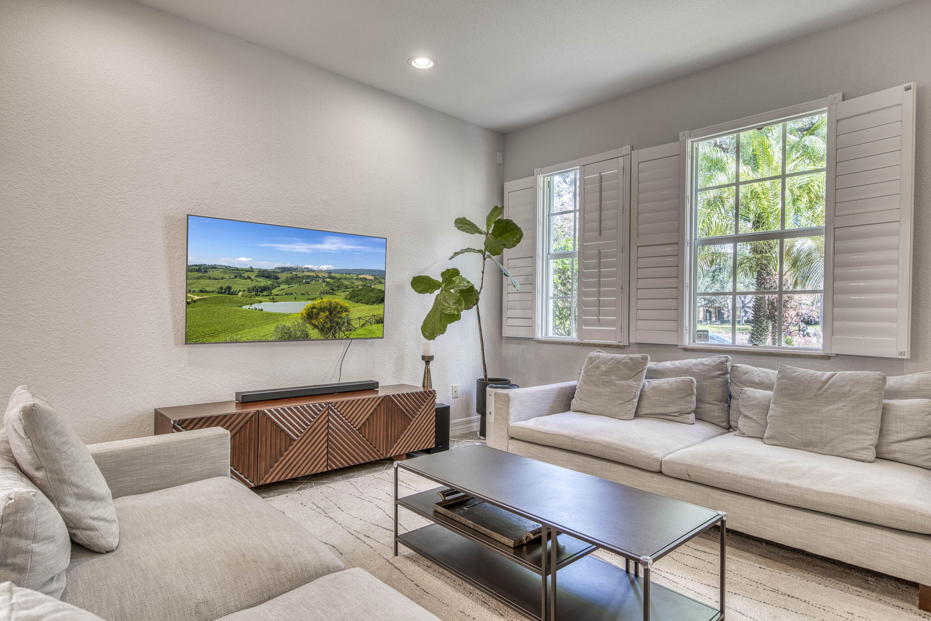 120 West Thatch Palm Circle Jupiter, FL 33458 - Photo 7 of 41 a living room with furniture and a window