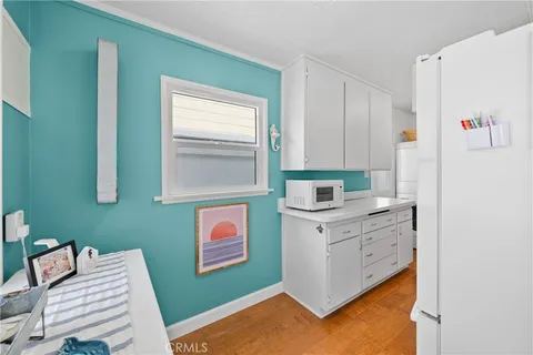 a kitchen with stainless steel appliances a refrigerator and a stove top oven