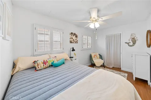 a bed room with a bed and a chandelier