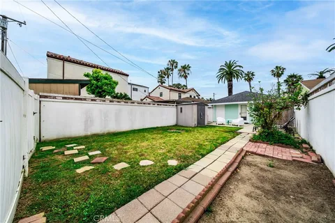 a view of a house with yard and a garage