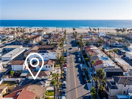 an aerial view of a house with a ocean view