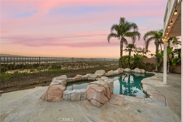 a bathroom with a double vanity sink a mirror and a bathtub