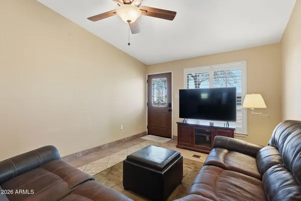 a living room with furniture and a window