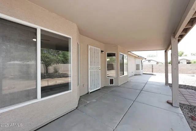 a view of a room with a glass door