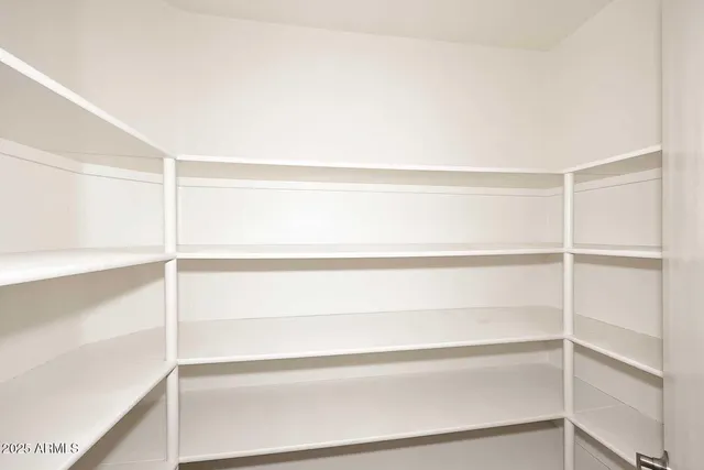 a empty closet with white paint