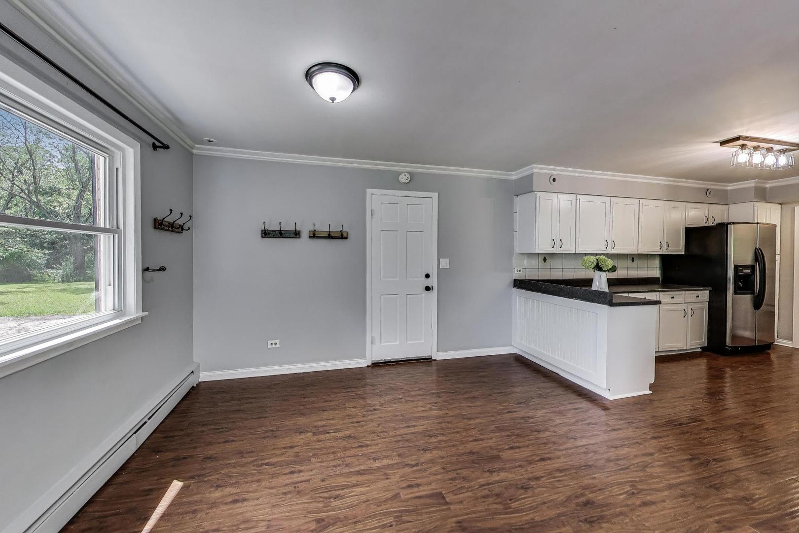 222 Bradwell Road Inverness, IL 60010 - Photo 18 of 46 a view of kitchen with wooden floor and electronic appliances