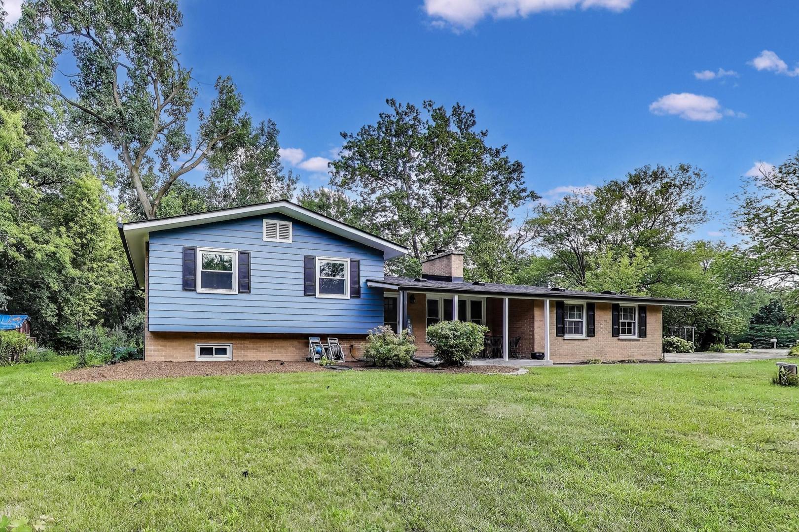 222 Bradwell Road Inverness, IL 60010 - Photo 2 of 46 a view of a house with backyard and garden