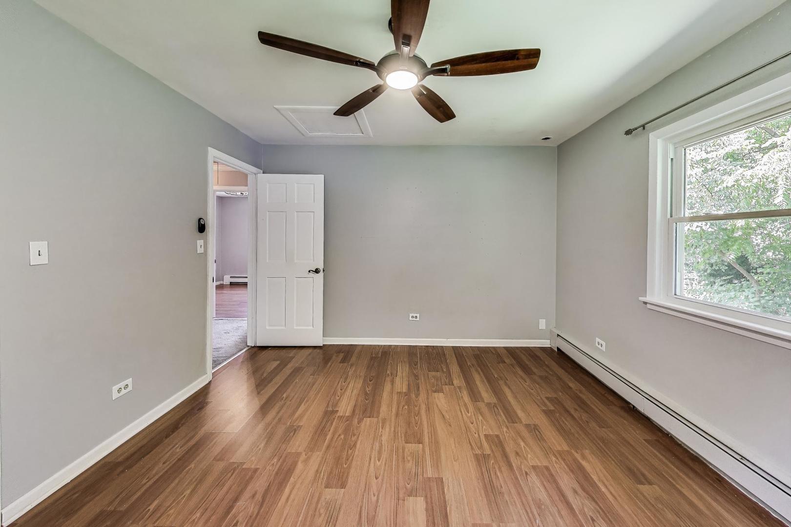 222 Bradwell Road Inverness, IL 60010 - Photo 27 of 46 wooden floor in an empty room with a window