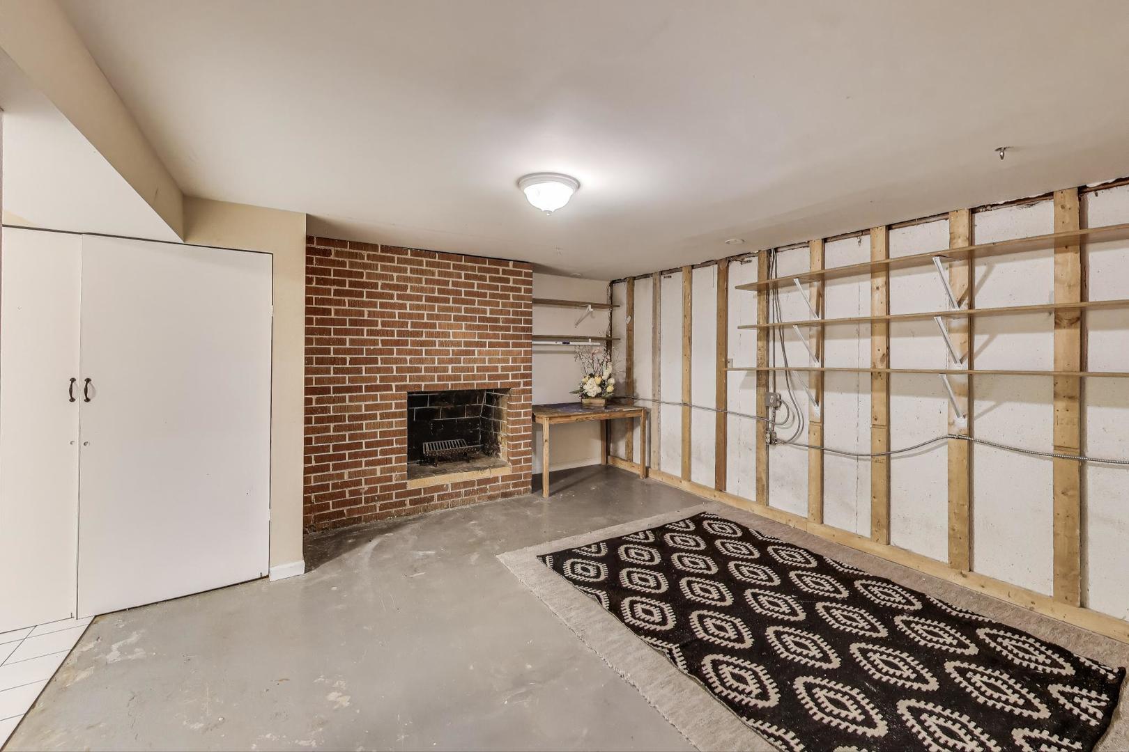 222 Bradwell Road Inverness, IL 60010 - Photo 37 of 46 a view of a livingroom with wooden floor and fireplace