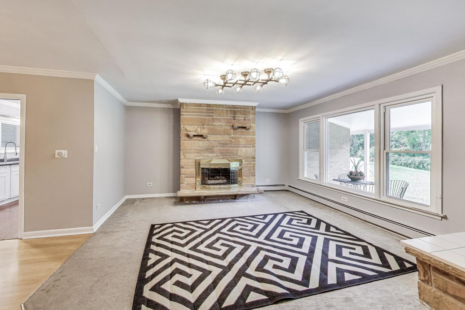 222 Bradwell Road Inverness, IL 60010 - Photo 10 of 46 wooden floor with a fireplace in a living room