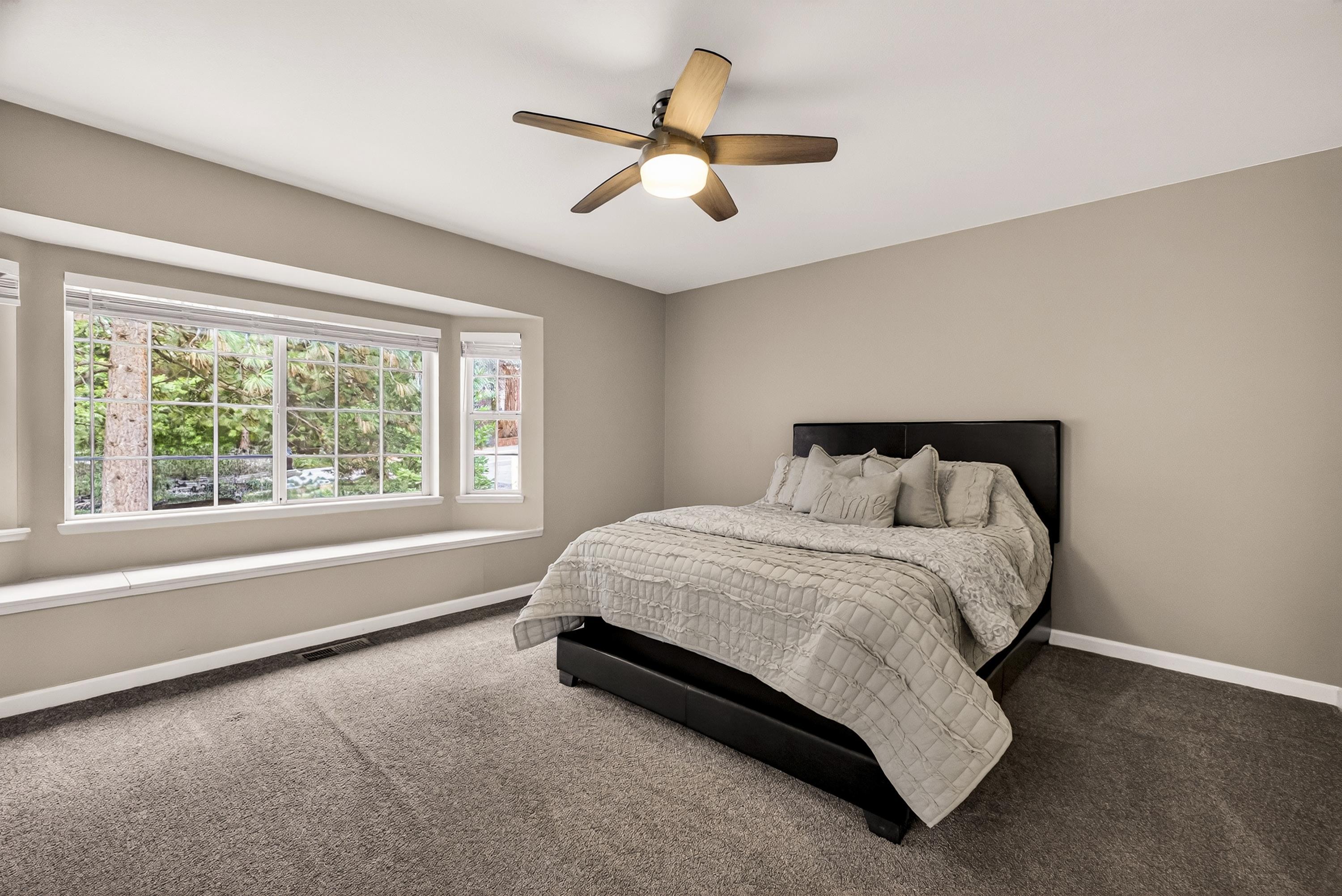 811 Golf Club Road Lake Almanor, CA 96137 - Photo 17 of 42 a bedroom with a bed and window