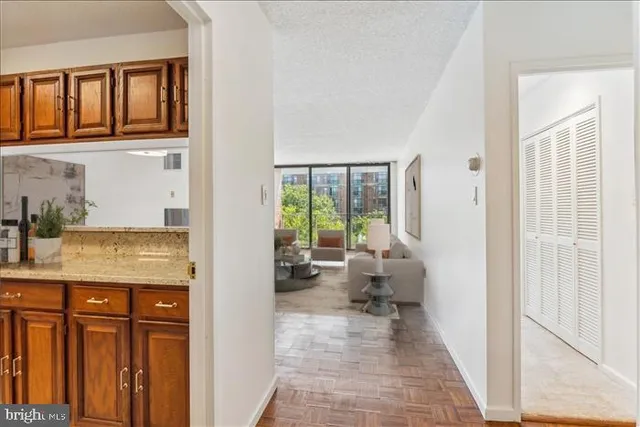 a view of living room with furniture and large window