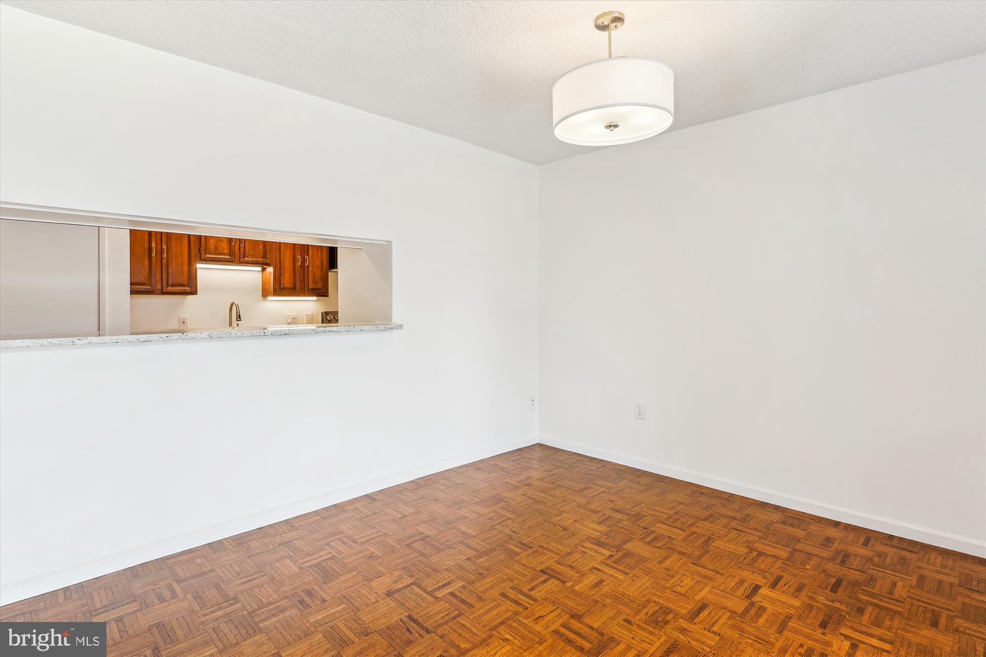 2555 Pennsylvania Avenue Northwest, Unit 816 Washington, DC 20037 - Photo 14 of 54 a bedroom with a bed and a dresser