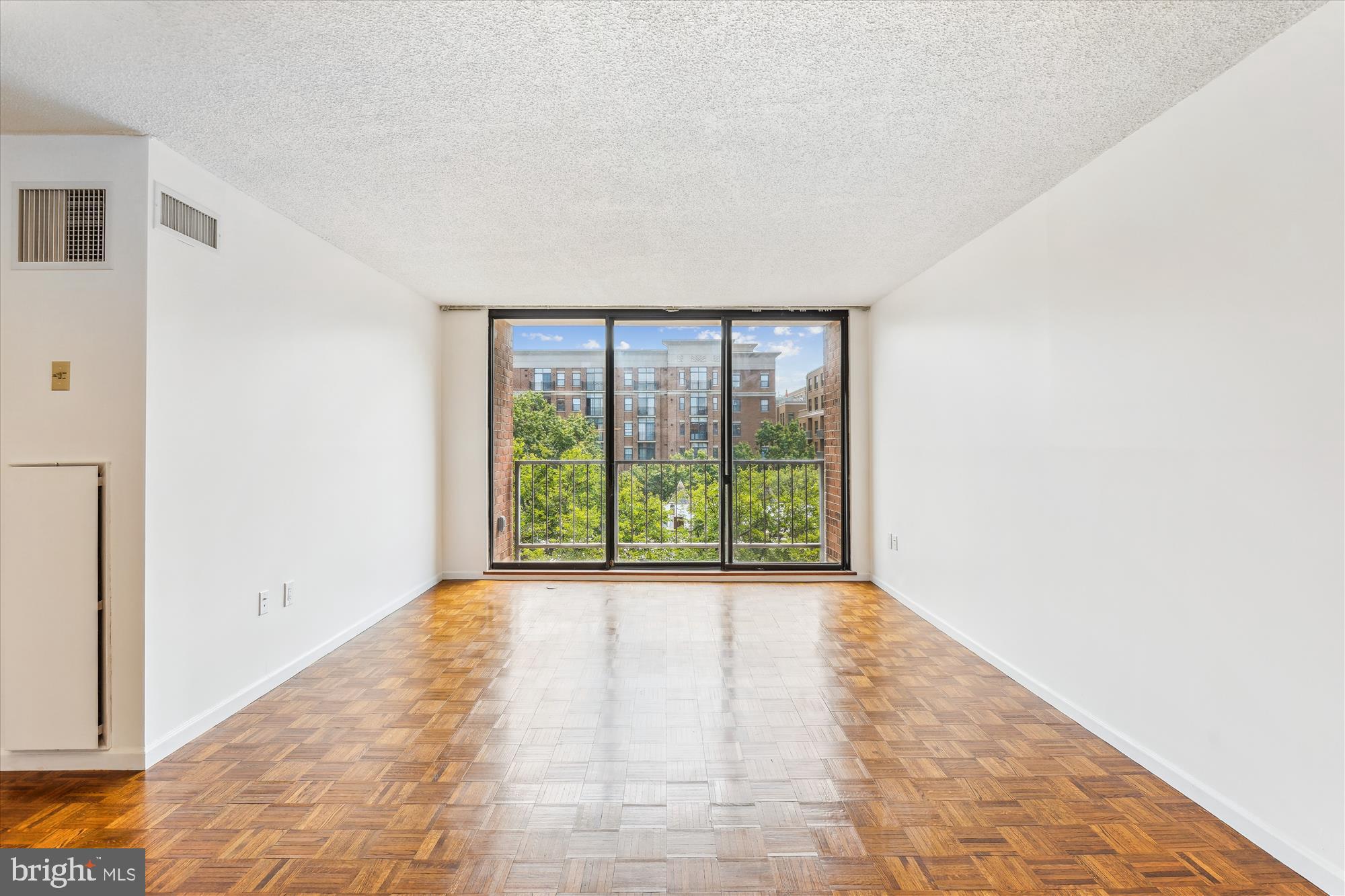2555 Pennsylvania Avenue Northwest, Unit 816 Washington, DC 20037 - Photo 18 of 54 a view of an empty room with a window