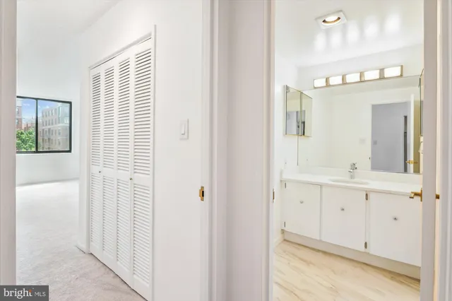 a bathroom with a sink a mirror and a window